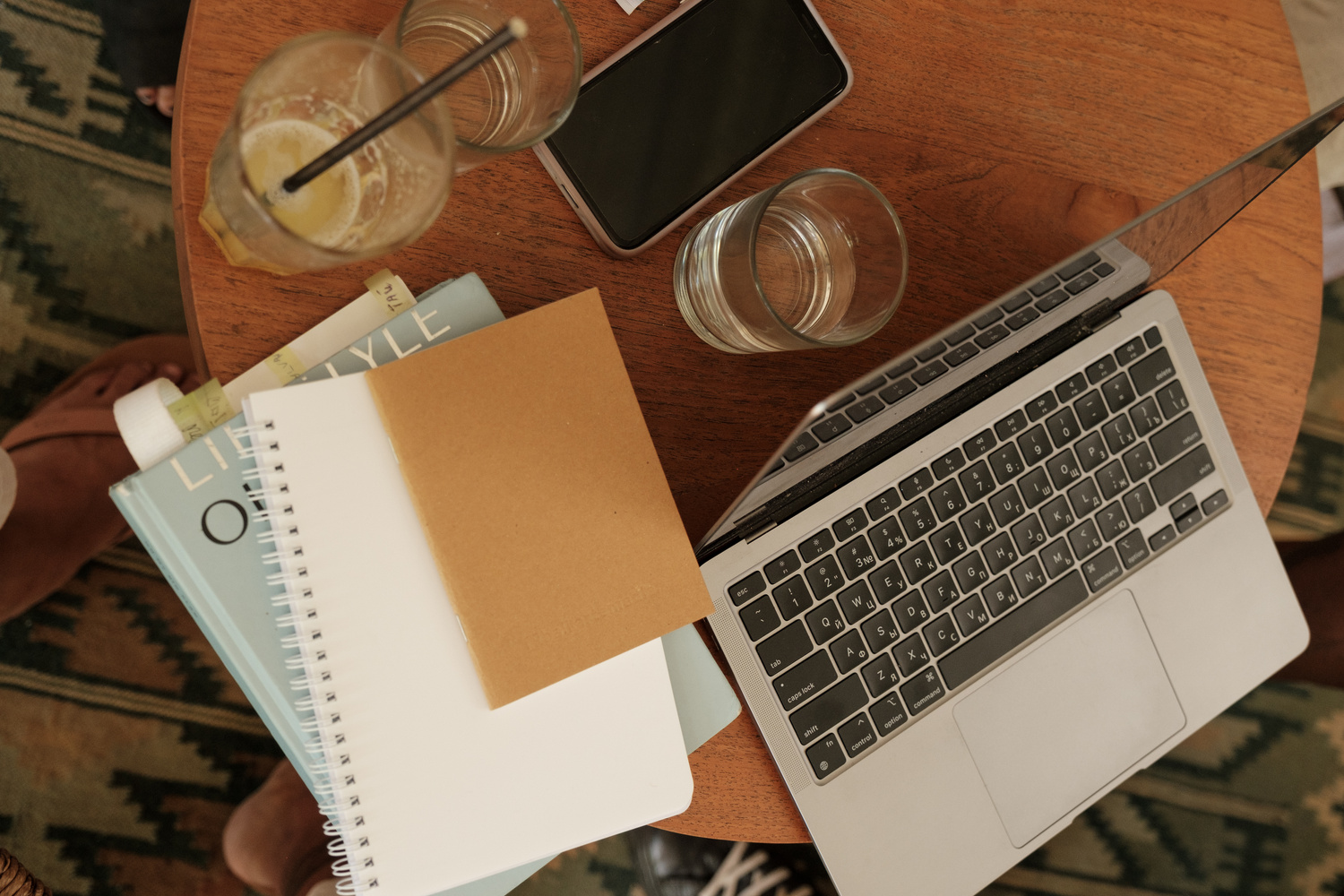 Laptop, Notebook and Drinks on Table